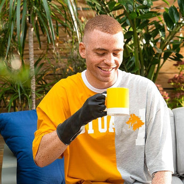 Two black Marigold outdoor gloves shown together as a matching pair